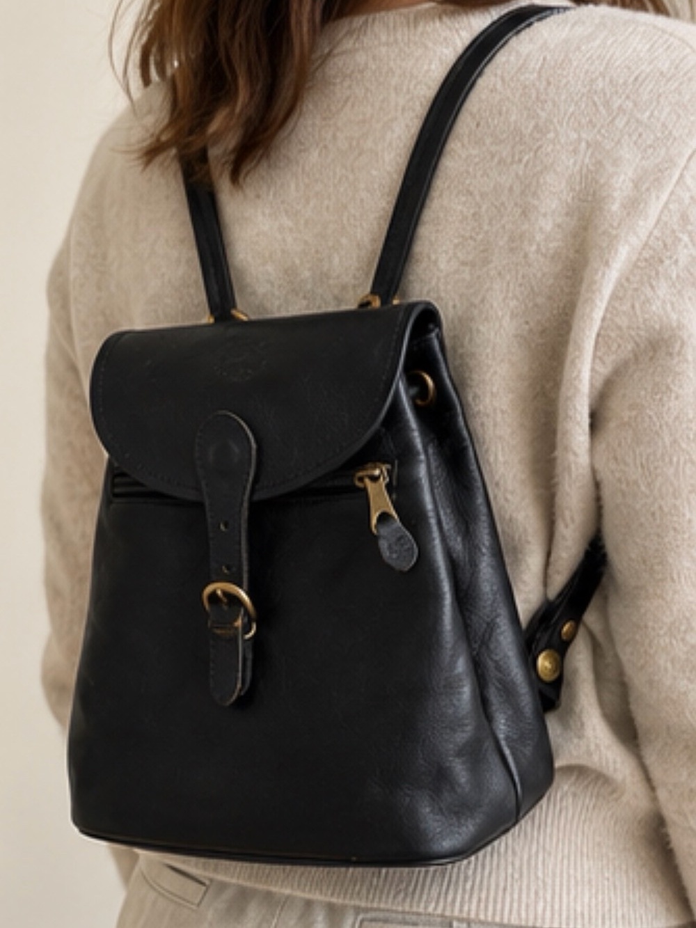Beautiful IL Bisonte black leather mini backpack with a timeless, minimalist de